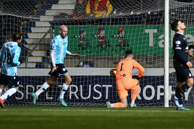 Zak Rudden opens the scoring for Dundee from the penalty spot. Picture: Michael Gillen