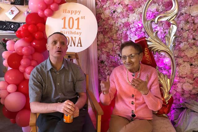 Centenarian Edna Clayton, with her son James, celebrating her 101st birthday surrounded by more than 30,000 cards sent following an online appeal at the Hector House care home in the Shawlands area of Glasgow.