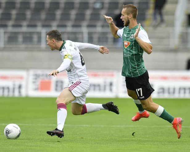 Celtic captain Callum McGregor shields the ball from FK Jablonec's Milos Kratochvil. (Radek Petrasek/CTK via AP)
