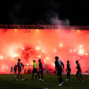 Rangers fans light up the Bob Shankly stand with pyrotechnics during a cinch Premiership match between Dundee FC and Rangers at The Scot Foam Stadium at Dens Park on Wednesday. (Photo by Ross Parker / SNS Group)