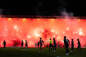 Rangers fans light up the Bob Shankly stand with pyrotechnics during a cinch Premiership match between Dundee FC and Rangers at The Scot Foam Stadium at Dens Park on Wednesday. (Photo by Ross Parker / SNS Group)