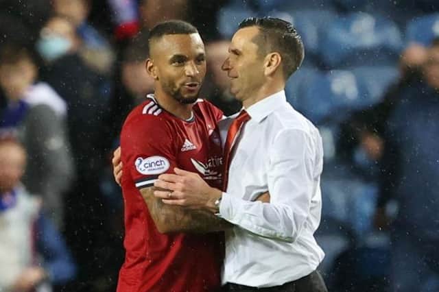 Aberdeen's Funso Ojo (left) and manager Stephen Glass at full time during a Cinch Premiership match between Rangers and Aberdeen at Ibrox stadium, on October 26, 2021, in Glasgow, Scotland. (Photo by Alan Harvey / SNS Group)