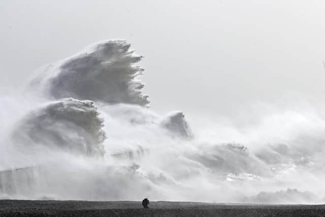 Waves crash over Newhaven harbour in East Sussex today. Picture: Glyn Kirk/AFP via Getty Images