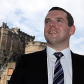 Douglas Ross warned the vaccine roll-out was becoming a "national scandal".