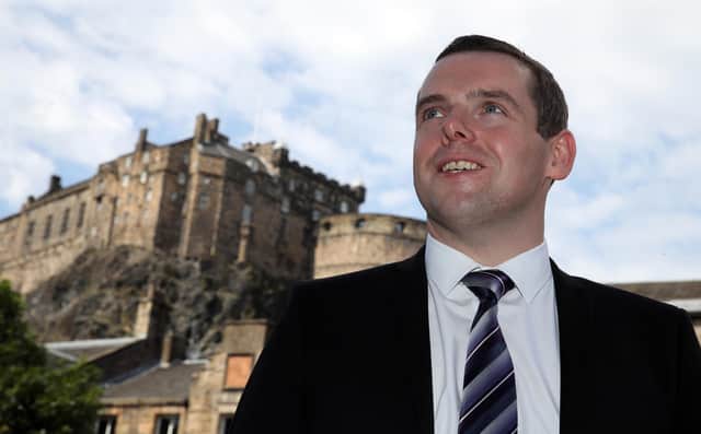 Douglas Ross warned the vaccine roll-out was becoming a "national scandal".