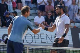 Matteo Berrettini of Italy and Andy Murray shake hands after day seven of the BOSS OPEN at Tennisclub Weissenhof on June 12, 2022 in Stuttgart, Germany. (Photo by Christian Kaspar-Bartke/Getty Images)