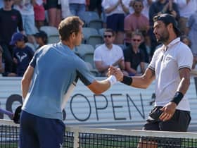 Matteo Berrettini of Italy and Andy Murray shake hands after day seven of the BOSS OPEN at Tennisclub Weissenhof on June 12, 2022 in Stuttgart, Germany. (Photo by Christian Kaspar-Bartke/Getty Images)