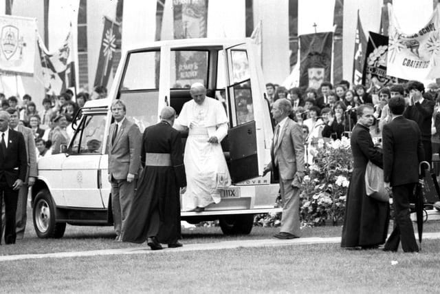 Pope John Paul II steps down from the 'Popemobile' at Murrayfield rugby stadium Edinburgh during the Papal visit.