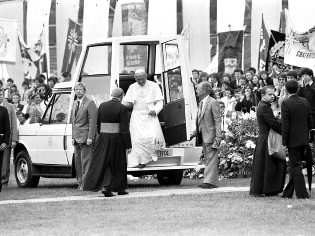 Pope John Paul II steps down from the 'Popemobile' at Murrayfield rugby stadium Edinburgh during the Papal visit.