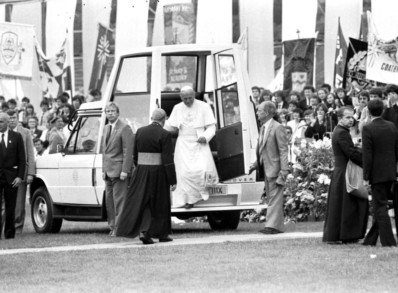 Pope John Paul II steps down from the 'Popemobile' at Murrayfield rugby stadium Edinburgh during the Papal visit.