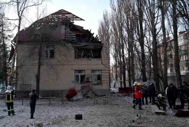 Rescuers  examine remains of a drone following a strike on an administrative building in the Ukrainian capital Kyiv (Picture: Sergei Supinsky/AFP via Getty Images)