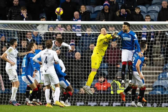 Rangers keeper Jon McLaughlin is spared by Conor Goldson heading away after missing a cross in a game wherein his uncertainty in such moments was at the heart of the loss of an equaliser to Ross County ahead of Rangers eventually running out 2-1 winners.  (Photo by Alan Harvey / SNS Group)