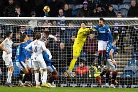 Rangers keeper Jon McLaughlin is spared by Conor Goldson heading away after missing a cross in a game wherein his uncertainty in such moments was at the heart of the loss of an equaliser to Ross County ahead of Rangers eventually running out 2-1 winners.  (Photo by Alan Harvey / SNS Group)