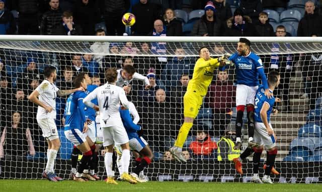 Rangers keeper Jon McLaughlin is spared by Conor Goldson heading away after missing a cross in a game wherein his uncertainty in such moments was at the heart of the loss of an equaliser to Ross County ahead of Rangers eventually running out 2-1 winners.  (Photo by Alan Harvey / SNS Group)