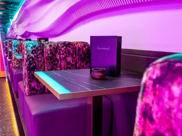 There's small booth seating by the entrance, which is also animal print