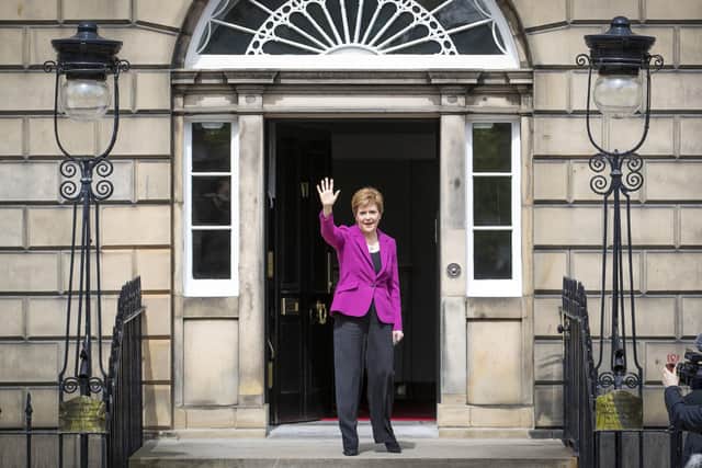 Nicola Sturgeon waves from the steps of Bute House in Edinburgh after the SNP won a fourth victory in the Scottish Parliament election (Picture: Jane Barlow/PA Wire)