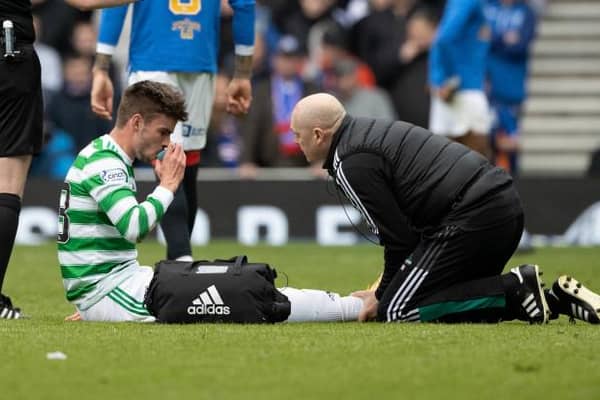 Celtic's Matt O'Riley receives treatment during Celtic's Old Firm win.  (Photo by Craig Williamson / SNS Group)