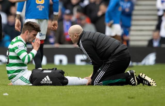 Celtic's Matt O'Riley receives treatment during Celtic's Old Firm win.  (Photo by Craig Williamson / SNS Group)
