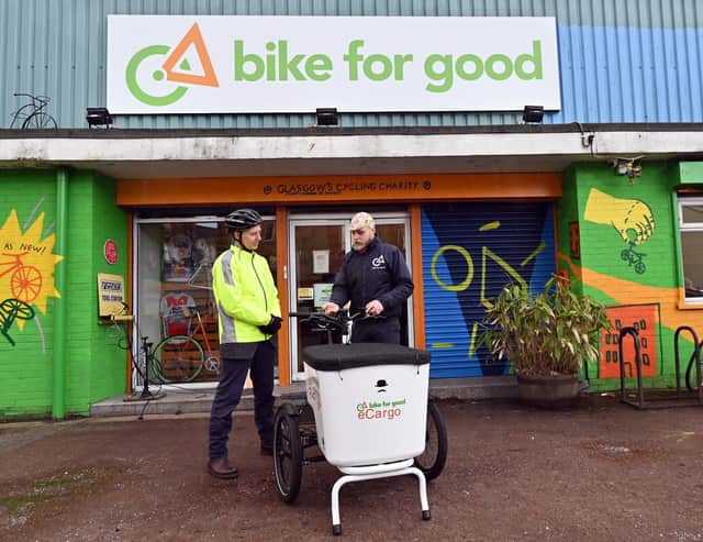Alastair Dalton being shown the e-cargo bike's controls by Karolis Toleikis of Bike for Good. Picture: John Devlin