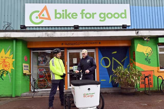 Alastair Dalton being shown the e-cargo bike's controls by Karolis Toleikis of Bike for Good. Picture: John Devlin