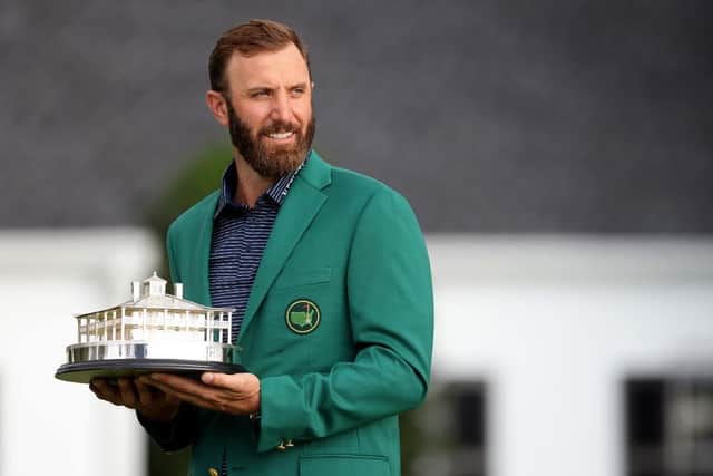 Dustin Johnson poses with the trophy after winning the Masters at Augusta National Golf Club in November, when the event was played behind closed doors. Picture: Rob Carr/Getty Images.