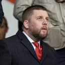 Aberdeen chief executive Alan Burrows watches on from the stand during the 3-1 win over Kilmarnock.