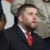 Aberdeen chief executive Alan Burrows watches on from the stand during the 3-1 win over Kilmarnock.