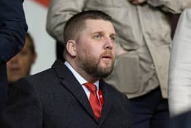 Aberdeen chief executive Alan Burrows watches on from the stand during the 3-1 win over Kilmarnock.