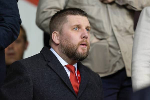 Aberdeen chief executive Alan Burrows watches on from the stand during the 3-1 win over Kilmarnock.