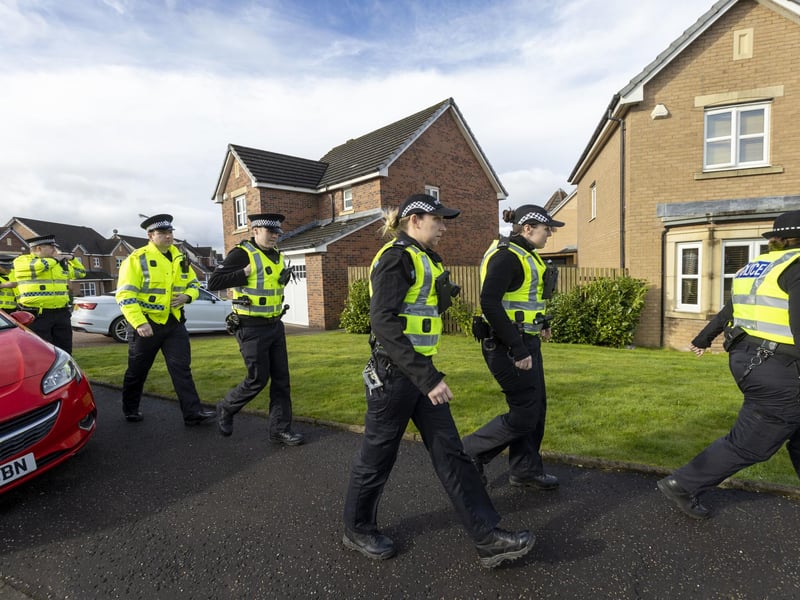 Several officers were stationed outside while plain-clothes officers could be seen entering and leaving the property, one carrying two large rolls of bubble wrap.