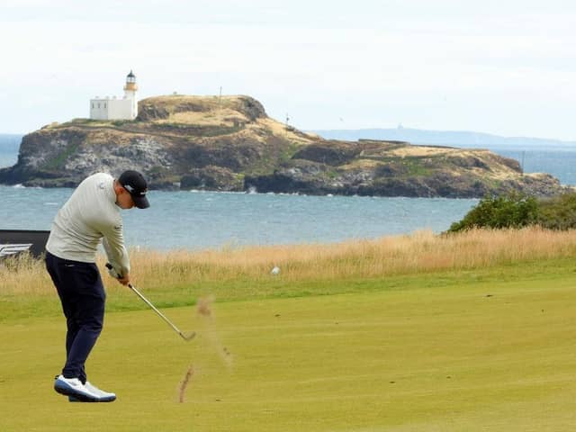 Matt Fitzpatrick  plays their second shot on the 13th hole in the second round of the Genesis Scottish Open at The Renaissance Club. Picture: Kevin C. Cox/Getty Images.