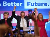 Labor Party leader Anthony Albanese, center back, celebrates with his partner partner Jodie Haydon, right, and Labor senate leader partner Penny Wong at a Labor Party event in Sydney, Australia, Sunday, May 22, 2022, after Prime Minister Scott Morrison conceding defeat to Albanese in a federal election. (AP Photo/Rick Rycroft)