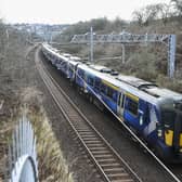 A ScotRail train on the main Edinburgh-Glasgow passes near the site of the proposed Winchburgh Station. The previous station closed in 1930. (Photo by Lisa Ferguson/The Scotsman)