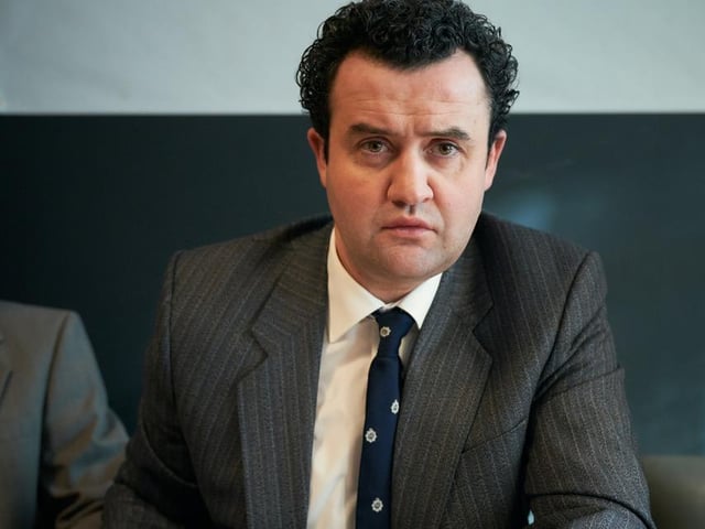 Daniel Mays, as Detective Peter Jay, meeting the press to appeal to the public to come to the police if they have any information on Dennis Nilsen.