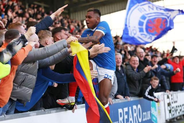 Alfredo Morelos leaps into the visiting support to celebrate his 100th goal for Rangers in their 2-1 win over St Mirren on Sunday. (Photo by Craig Williamson / SNS Group)