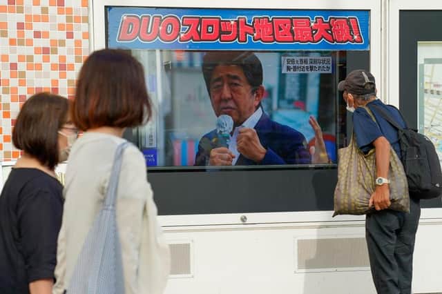 A screen broadcasting the news of Japan's former Prime Minister Shinzo Abe who has been shot while campaigning in Nara, Japan.