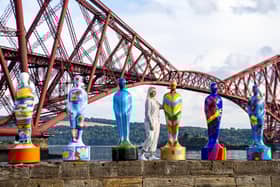 Isy Langhorne stands beside Gratitude sculptures erected as tribute to NHS key workers (Photo: Lisa Ferguson).