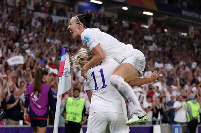 Georgia Stanway is mobbed by her England team mates as she celebrates scoring her sides second goal against Spain (Photo by Naomi Baker/Getty Images)