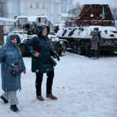Members of the public are seen in the snow in Kyiv, Ukraine. Ukrainian officials expect a new wave of Russian bombing this week, with previous rounds targeting critical infrastructure and causing massive water and power cuts, including in the capital Kyiv.