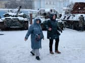 Members of the public are seen in the snow in Kyiv, Ukraine. Ukrainian officials expect a new wave of Russian bombing this week, with previous rounds targeting critical infrastructure and causing massive water and power cuts, including in the capital Kyiv.