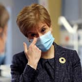 Watching footage of the first person in the UK to receive the Pfizer coronavirus vaccine gave First Minister Nicola Sturgeon a “lump in the throat”, she has said. (Photo by Russell Cheyne - Pool/Getty Images)