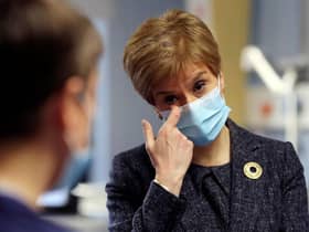 Watching footage of the first person in the UK to receive the Pfizer coronavirus vaccine gave First Minister Nicola Sturgeon a “lump in the throat”, she has said. (Photo by Russell Cheyne - Pool/Getty Images)