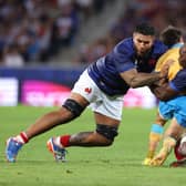 Santiago Arata of Uruguay is tackled by Romain Taofifenua and Sekou Macalou of France which resulted in a yellow card for Taofifenua for a dangerous tackle. (Photo by Warren Little/Getty Images)