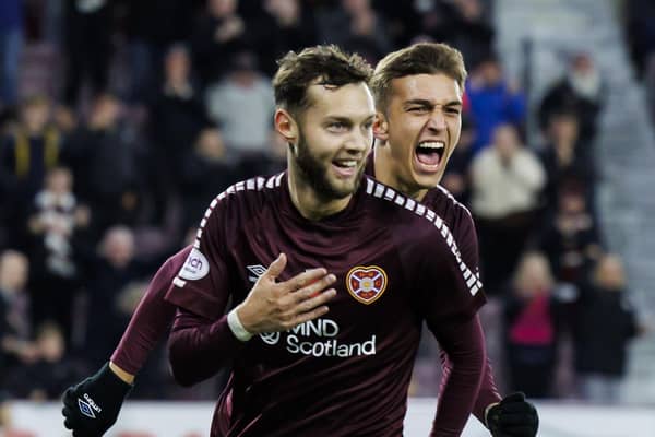Hearts' Jorge Grant (front) celebrates with goalscorer Kenneth Vargas after providing the assist as the Costa Rican striker opened his acccount against Livingston. Photo by Mark Scates / SNS Group