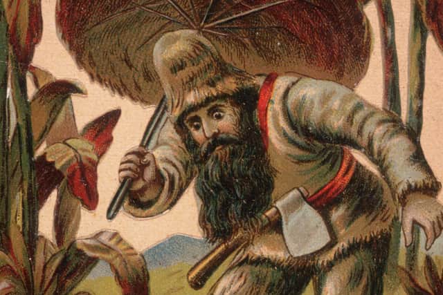An 18th-century image of Robinson Crusoe exploring the desert island with his hand-made umbrella (Picture: Hulton Archive/Getty Images)