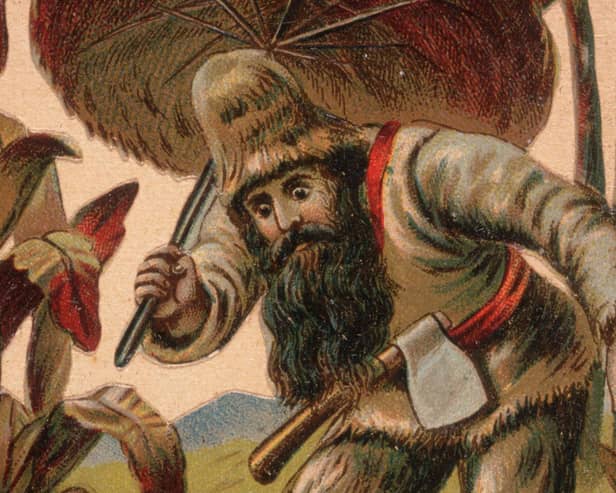 An 18th-century image of Robinson Crusoe exploring the desert island with his hand-made umbrella (Picture: Hulton Archive/Getty Images)