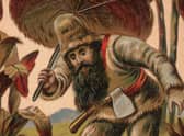 An 18th-century image of Robinson Crusoe exploring the desert island with his hand-made umbrella (Picture: Hulton Archive/Getty Images)