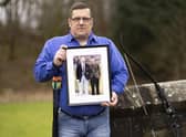 Alan Kennedy at the Erskine Home in Bishopton, Renfrewshire, holding a picture of himself in the Royal Scots army with his father. Picture: PA