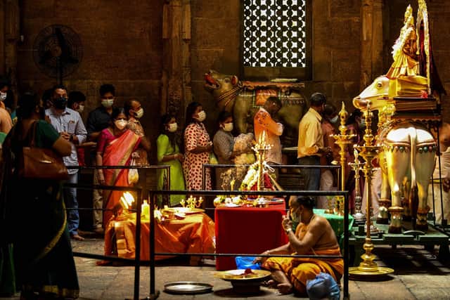 Hindu devotees gather at a temple to offer prayers during Diwali, the festival of lights, in Colombo on November 4, 2021. (Image credit: ISHARA S. KODIKARA/AFP via Getty Images)
