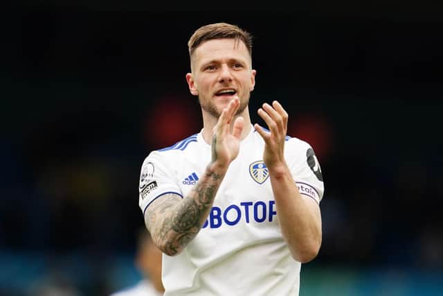 Liam Cooper of Leeds United acknowledges the fans following the Premier League match between Leeds United and West Bromwich Albion at Elland Road on May 23, 2021 in Leeds, England. (Photo by Jon Super - Pool/Getty Images)